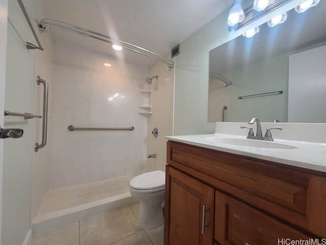 full bathroom featuring vanity, visible vents, a stall shower, tile patterned flooring, and toilet