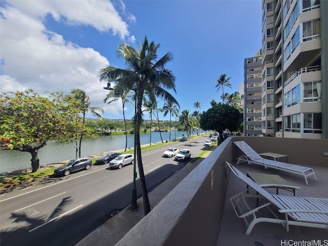 view of street with sidewalks and a water view