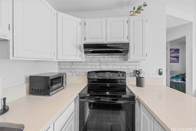 kitchen with white cabinetry and black electric range oven