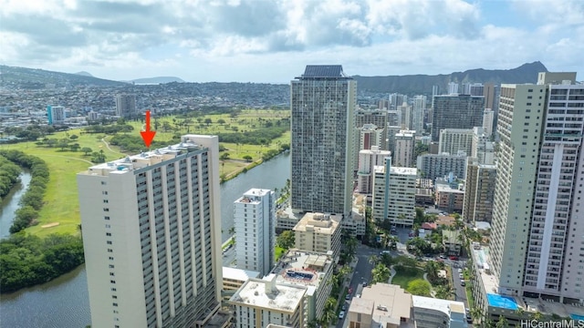 property's view of city with a water and mountain view