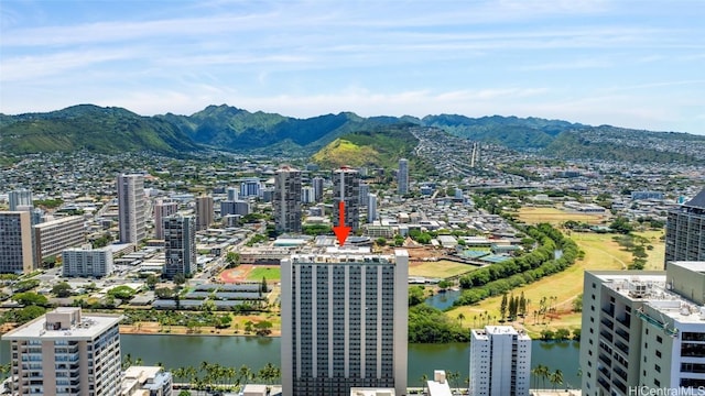 drone / aerial view featuring a water and mountain view