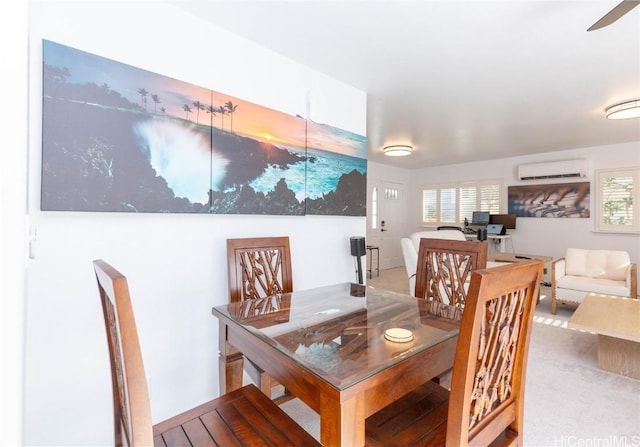 dining space featuring a wall unit AC