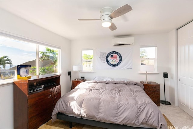 bedroom featuring a wall mounted air conditioner, light colored carpet, and ceiling fan