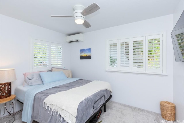 carpeted bedroom with ceiling fan and a wall unit AC