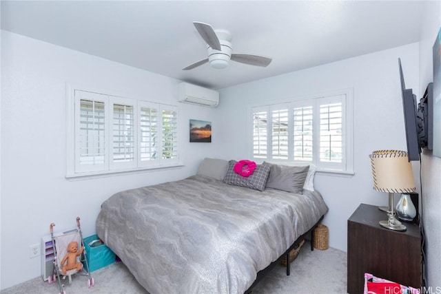 bedroom featuring ceiling fan and a wall unit AC