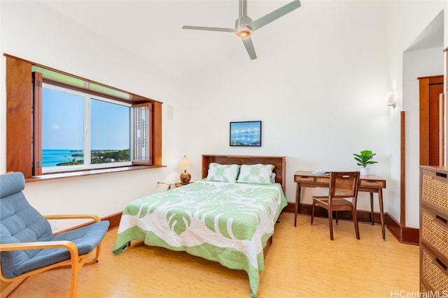 bedroom with light hardwood / wood-style floors and ceiling fan