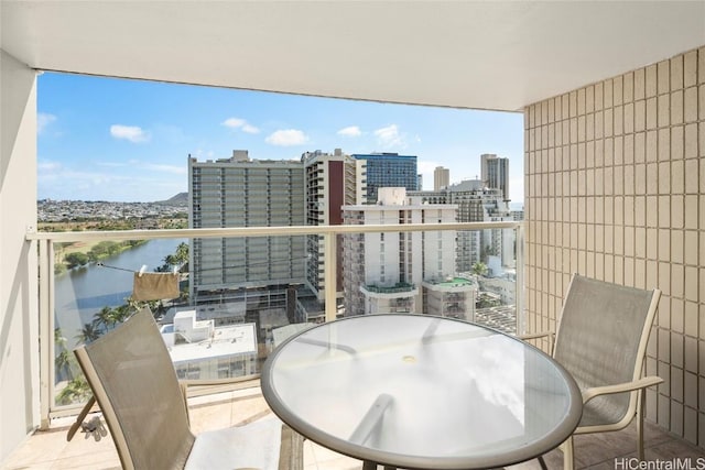 balcony featuring a water view