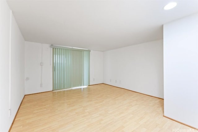 spare room with light hardwood / wood-style floors