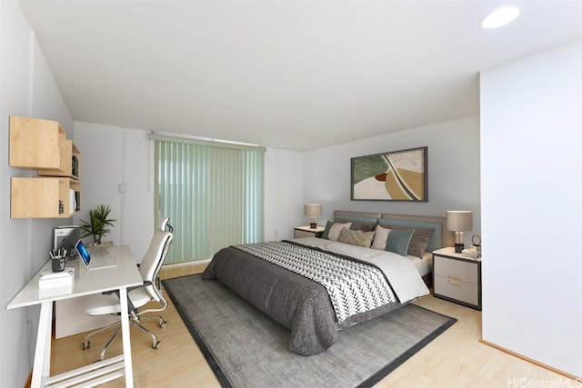 bedroom with light wood-type flooring