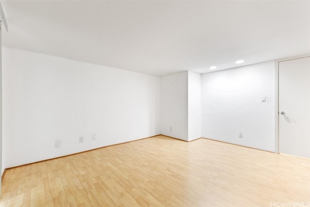 unfurnished room with light hardwood / wood-style flooring