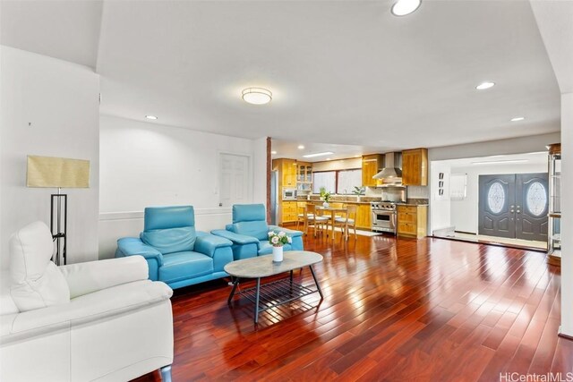 living room with a healthy amount of sunlight and hardwood / wood-style floors