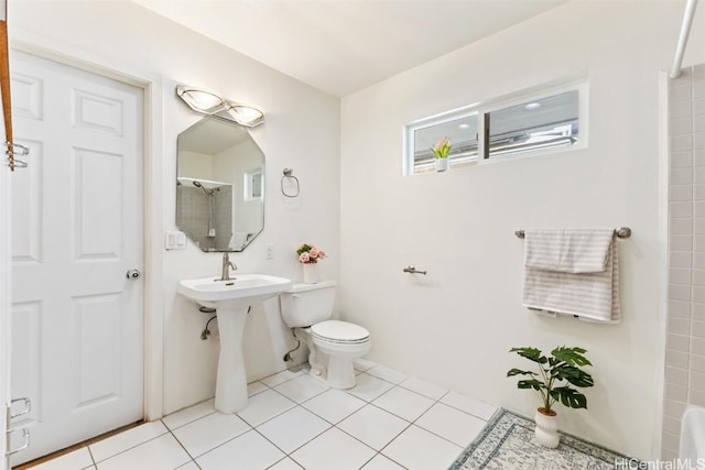 bathroom with walk in shower, toilet, and tile patterned flooring