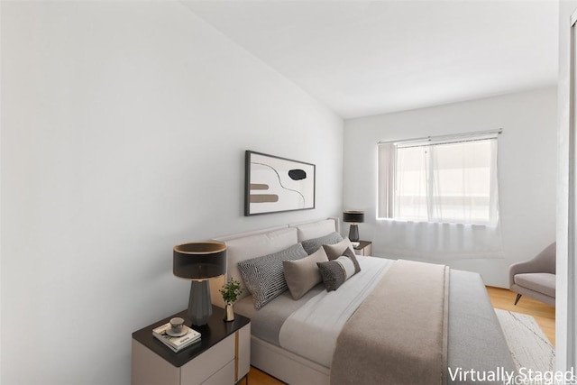 bedroom with light wood-type flooring