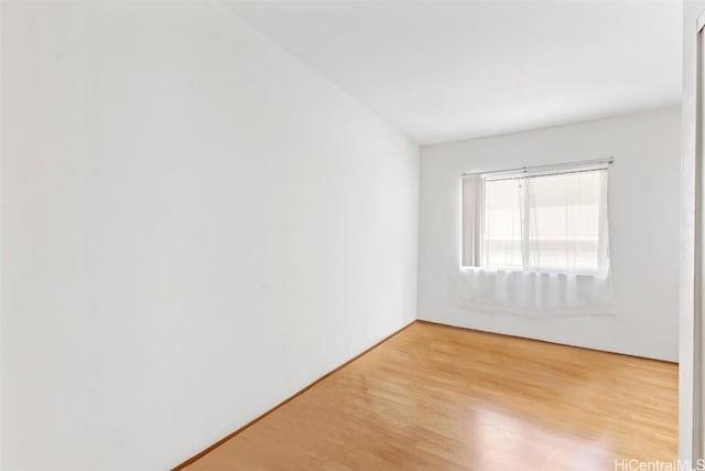 unfurnished room with light hardwood / wood-style floors