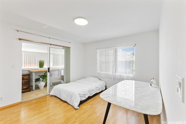 bedroom featuring hardwood / wood-style flooring