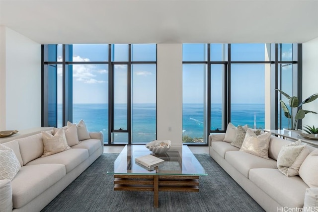 living room with a water view and expansive windows