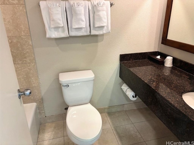 bathroom featuring tile patterned flooring and toilet