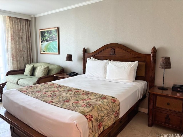 bedroom with ornamental molding and light tile patterned floors