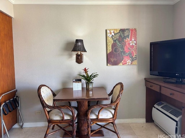 dining area with light tile patterned flooring and ornamental molding