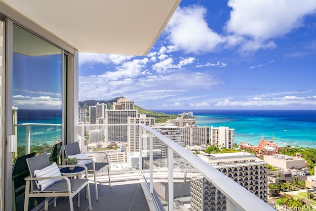 balcony featuring a water view