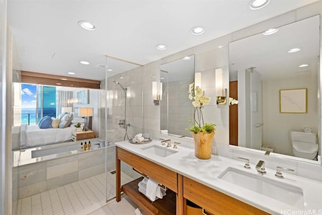 bathroom with walk in shower, vanity, toilet, and tile patterned flooring