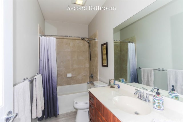 full bathroom featuring vanity, shower / bath combination with curtain, and toilet