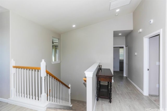 stairway with hardwood / wood-style floors