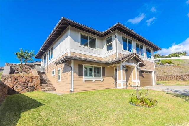 view of front of home featuring a garage and a front lawn