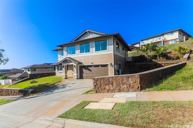 view of front facade with a garage and a front lawn