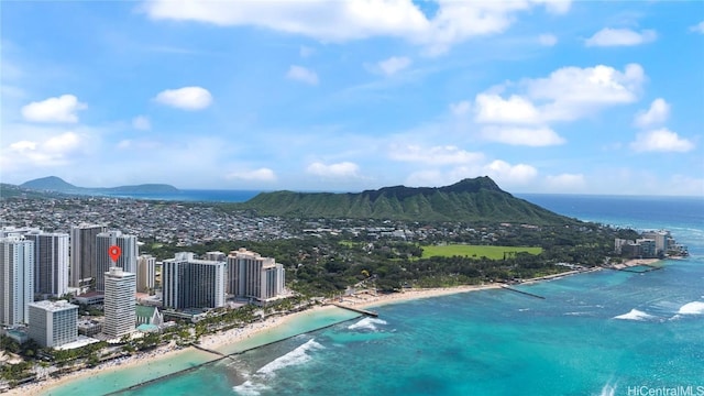 bird's eye view featuring a view of city, a beach view, and a water and mountain view