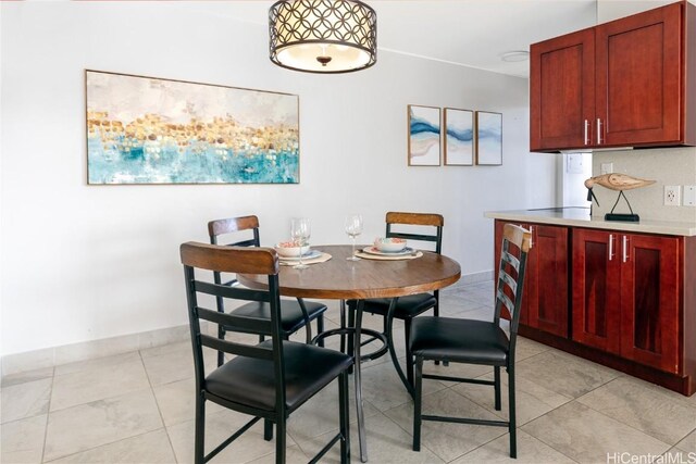 dining space with light tile patterned flooring