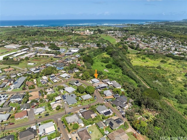 drone / aerial view with a water view and a residential view