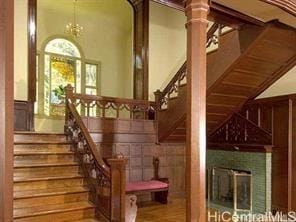 staircase featuring an inviting chandelier