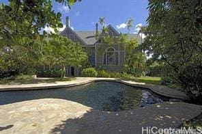 view of swimming pool with a patio area