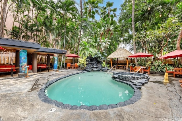 view of swimming pool with a gazebo and a patio area