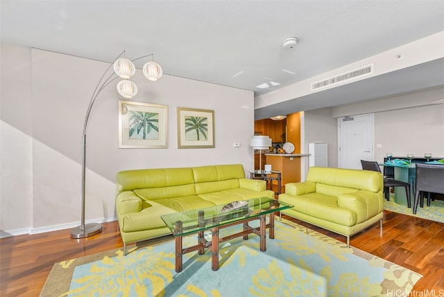 living room with dark hardwood / wood-style flooring