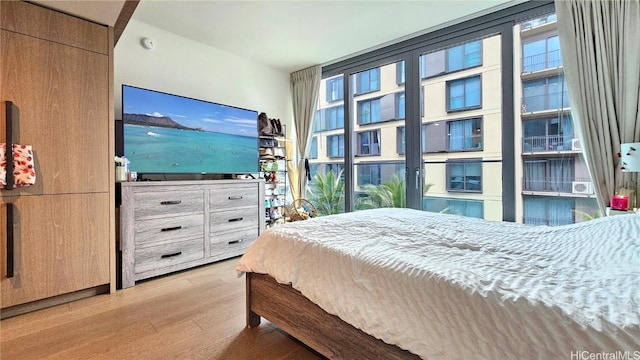 bedroom with light hardwood / wood-style floors