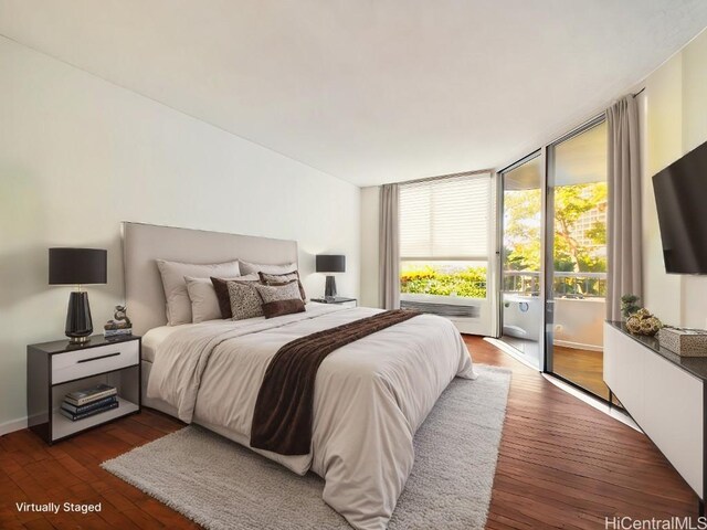 bedroom with dark hardwood / wood-style flooring and access to exterior