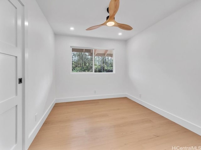 empty room featuring ceiling fan and light hardwood / wood-style floors