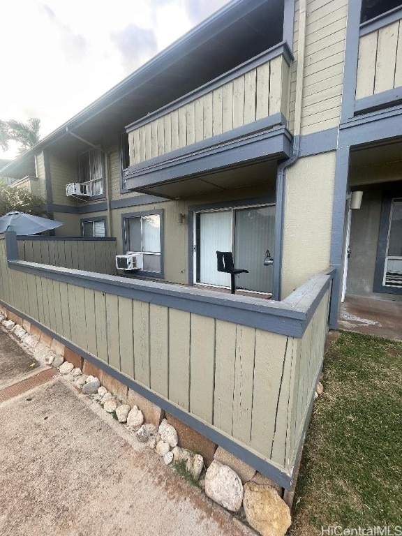 view of side of property featuring cooling unit