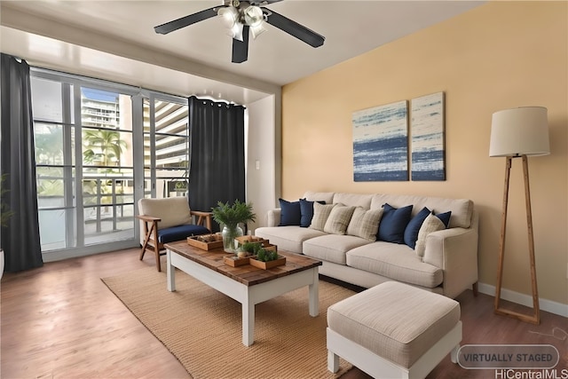 living room with hardwood / wood-style floors and ceiling fan