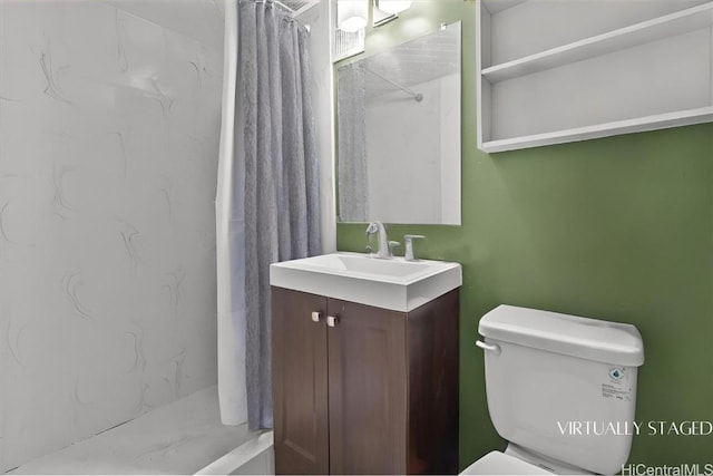 bathroom featuring vanity, curtained shower, and toilet