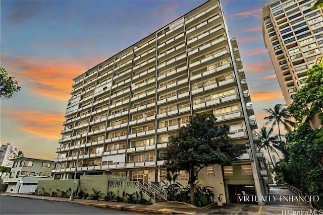 view of outdoor building at dusk