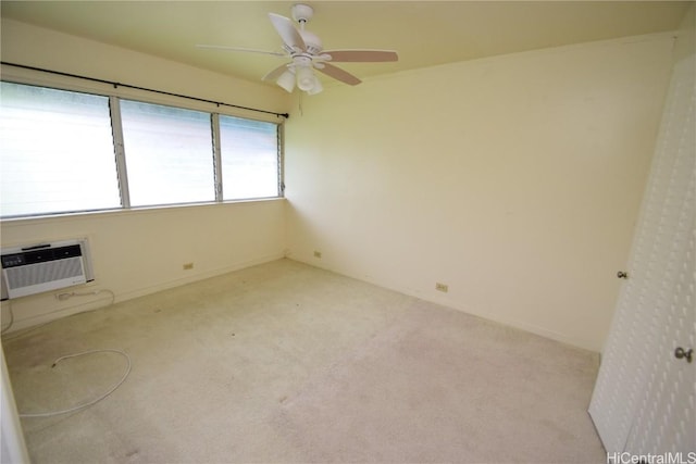 carpeted empty room with ceiling fan and a wall mounted air conditioner