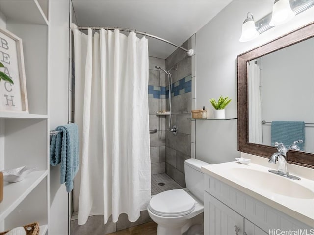 bathroom with vanity, a shower with shower curtain, and toilet