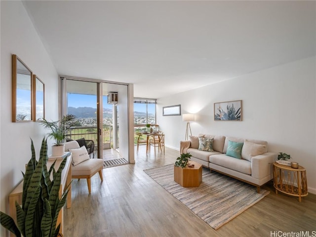 living room featuring hardwood / wood-style floors and floor to ceiling windows