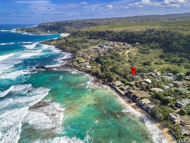 bird's eye view featuring a water view and a view of the beach