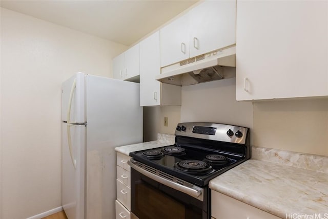 kitchen with white cabinetry, stainless steel electric range oven, and white refrigerator