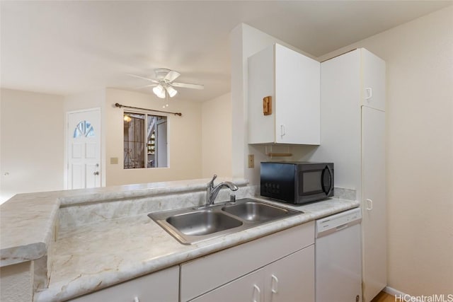 kitchen with sink, dishwasher, ceiling fan, white cabinetry, and kitchen peninsula