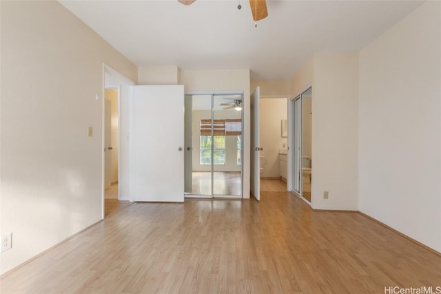 empty room featuring ceiling fan and light hardwood / wood-style floors